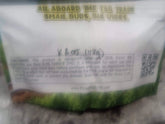 A white plastic bag labeled all aboard the tsb train containing green THCa small buds flower priced at 805 for 112g